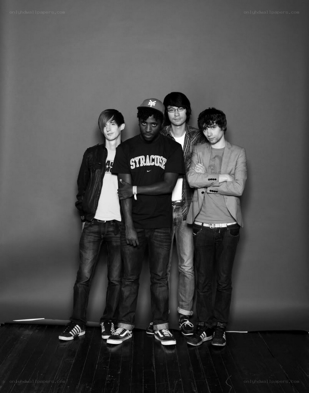 four young men in studio portrait