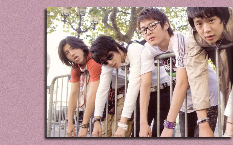Four Young Men Leaning