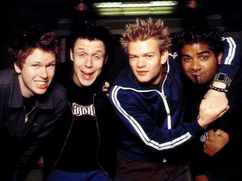 Four Young Men Posing — Blue, Energetic