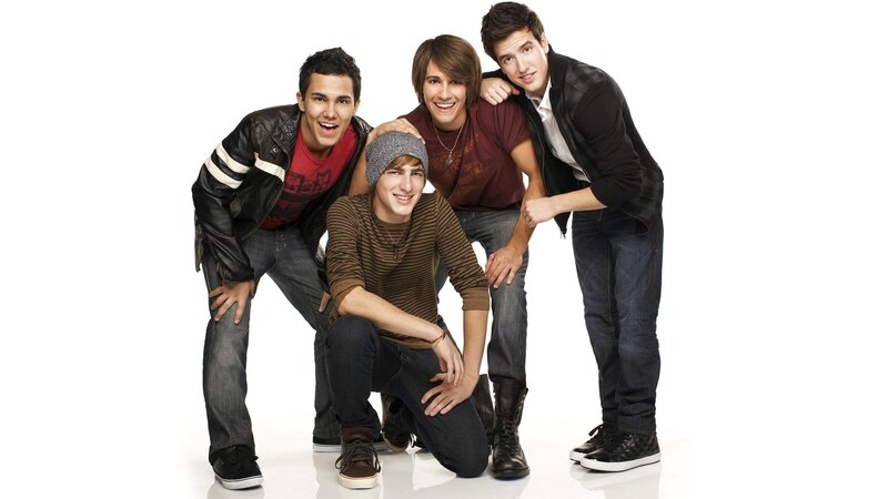 four young men posing together