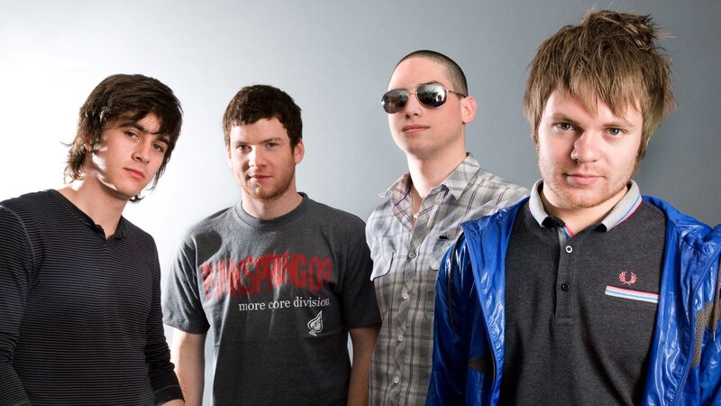 Four Young Men Standing — Gray