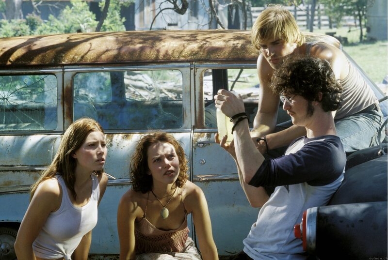 Four Young People Near Car