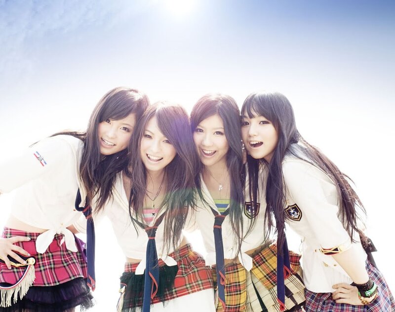 four young women in school uniforms