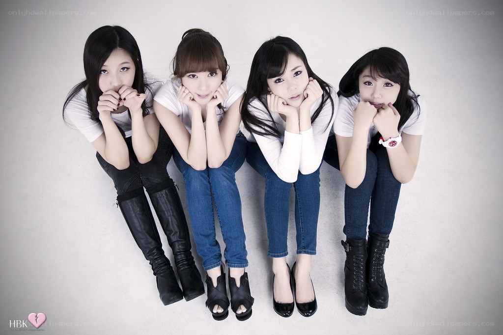 four young women posing together