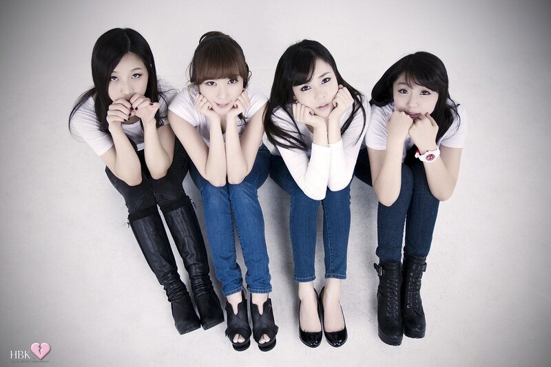 Four Young Women Sitting — White