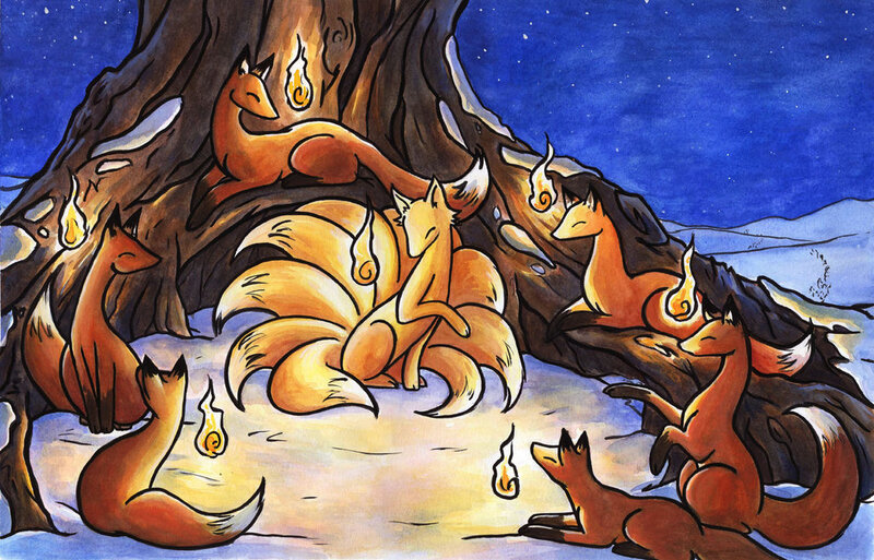 Foxes around a tree at night