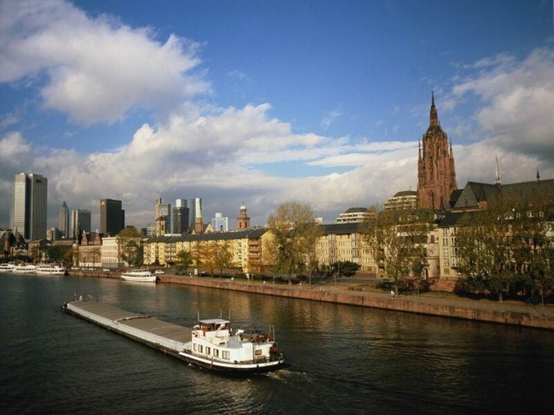 Frankfurt skyline with river and boat