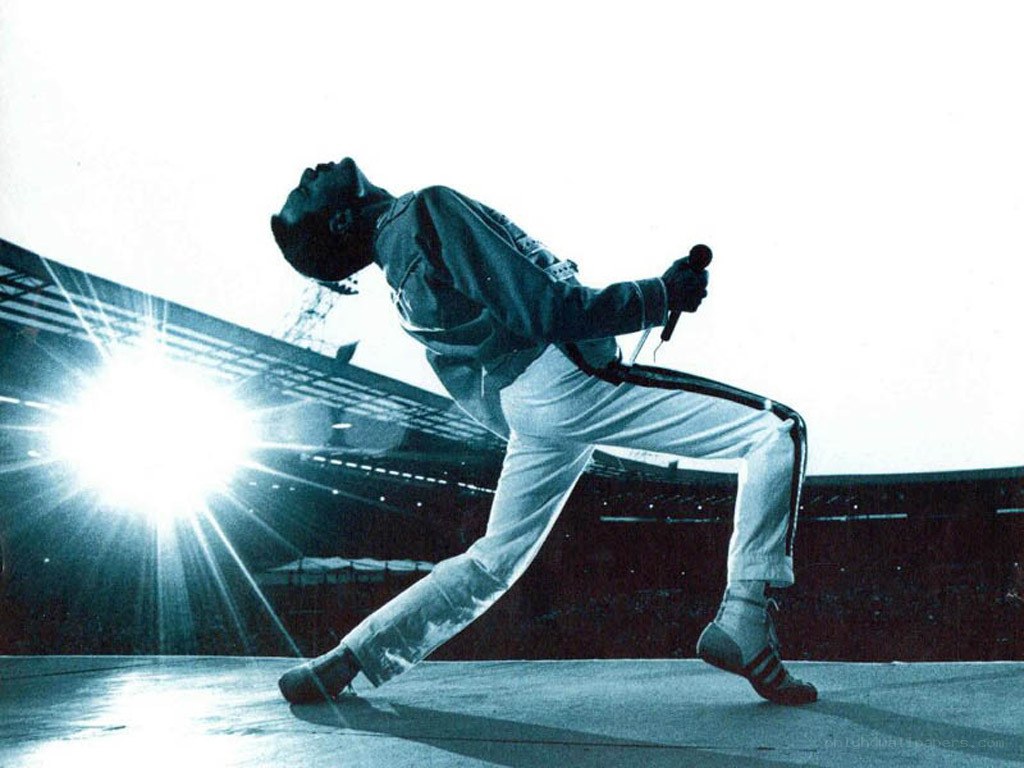 Freddie Mercury performing on stage