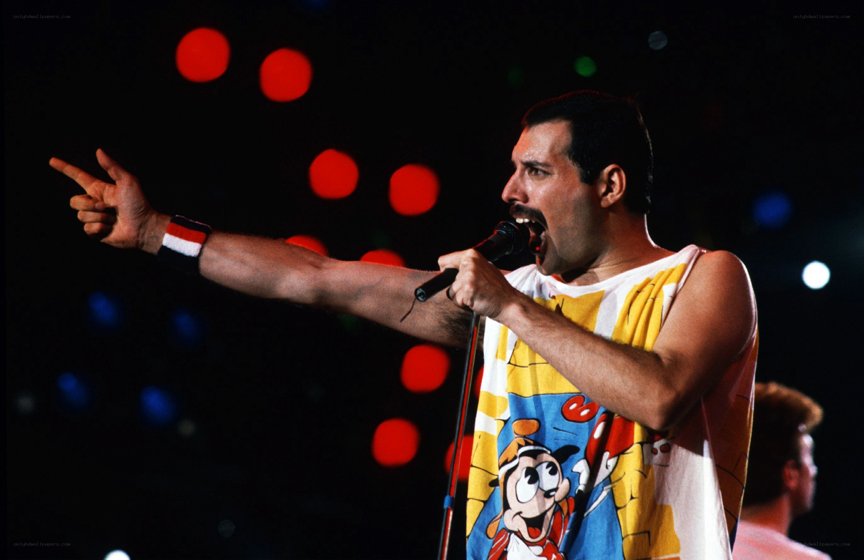 Freddie Mercury performing on stage