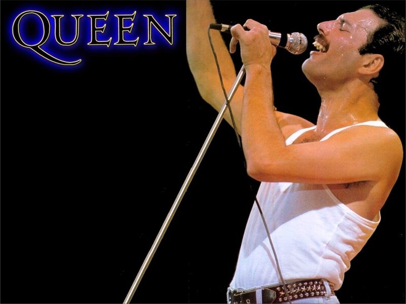 Freddie Mercury singing on stage