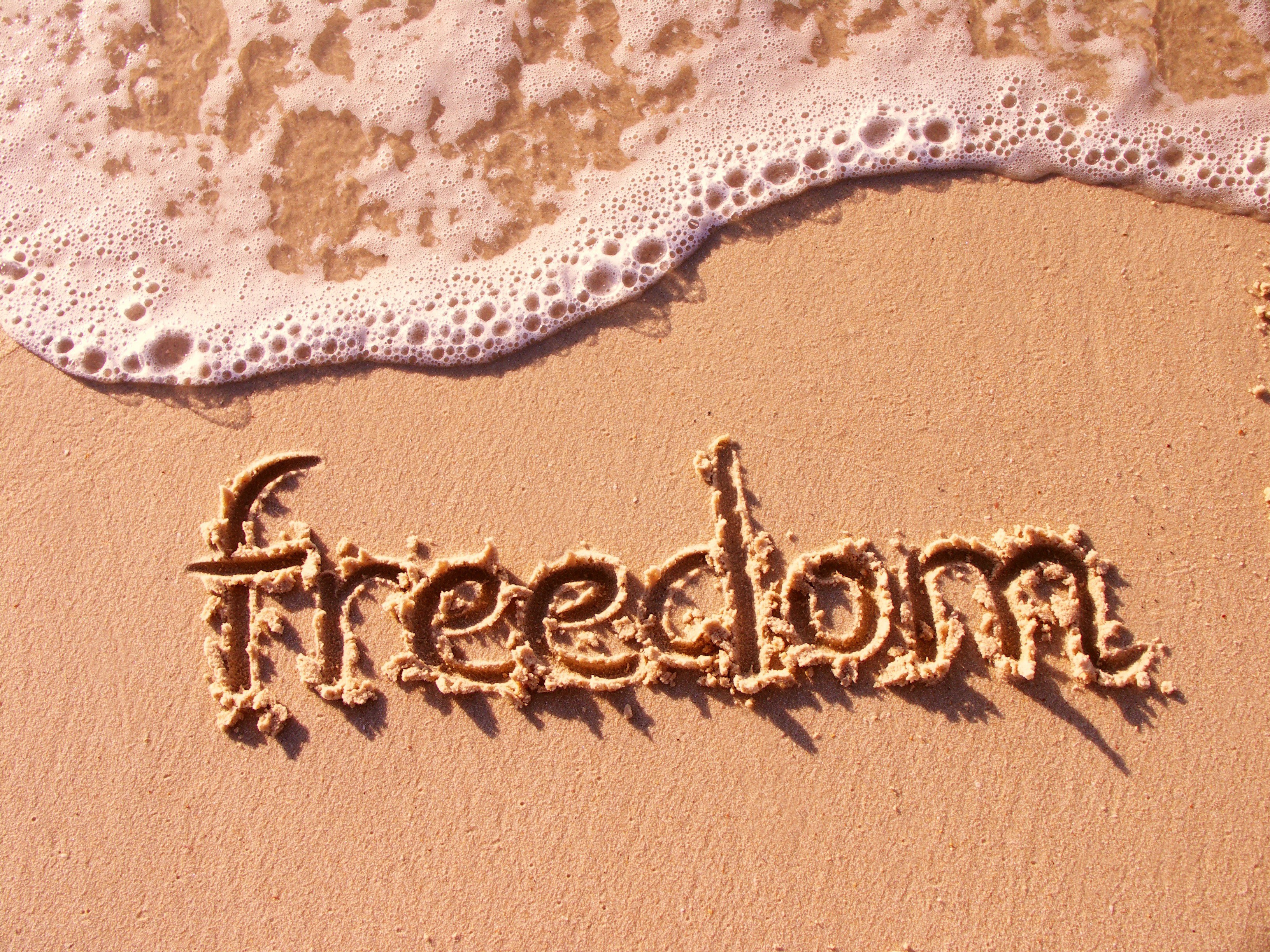 freedom written in sand