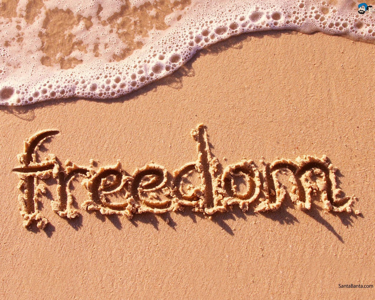 freedom written in sand