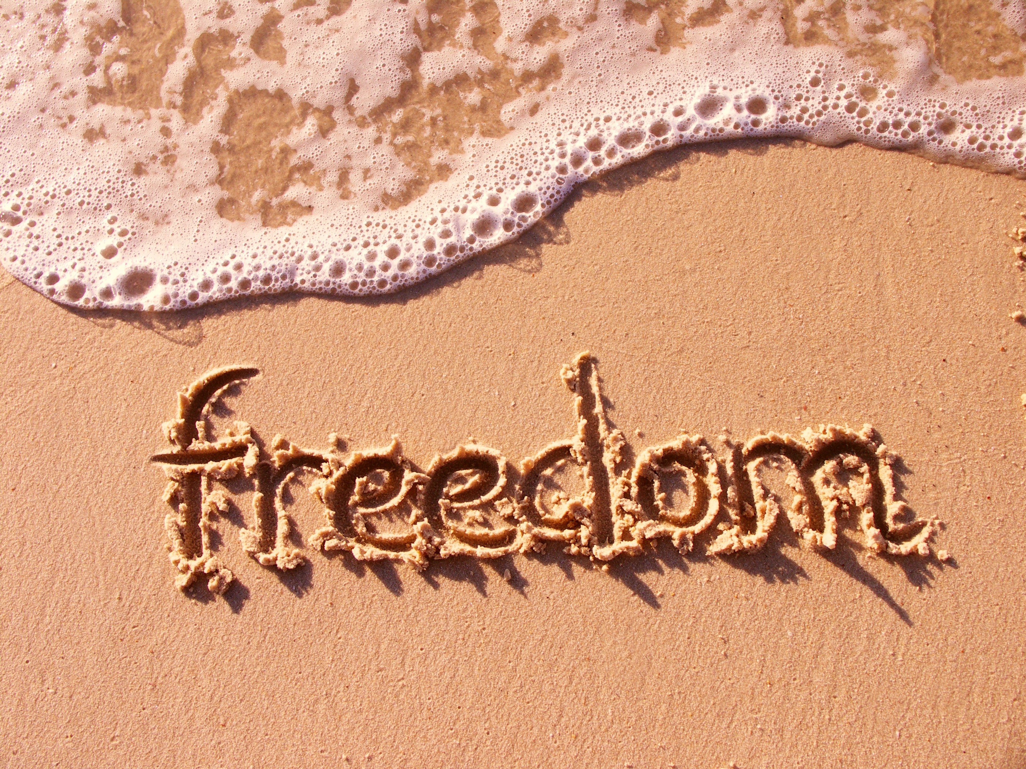 freedom written in sand