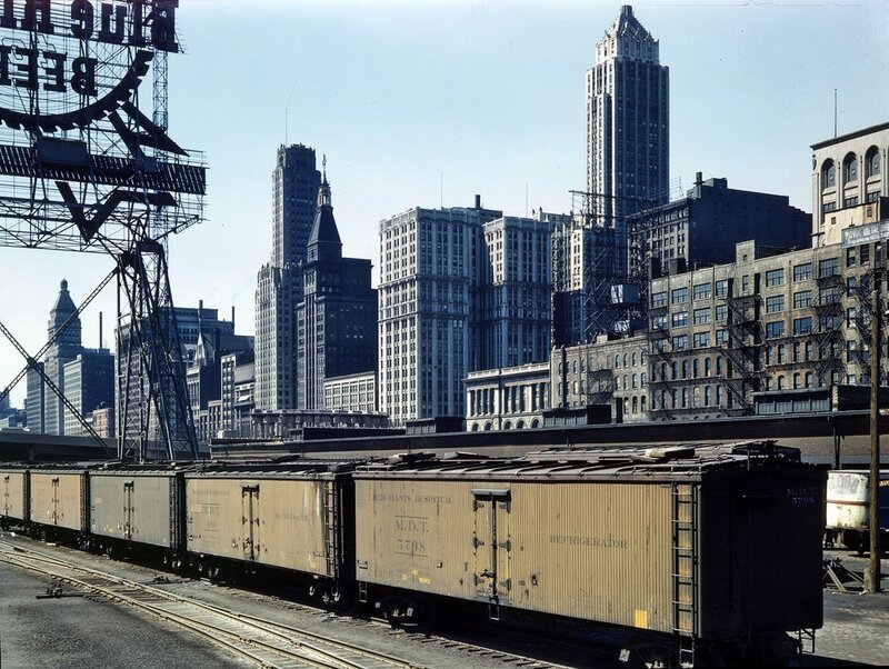 Freight train in city skyline