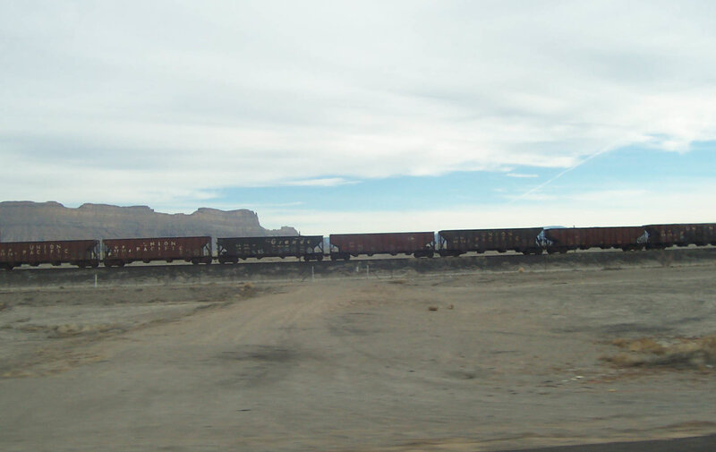 freight train in desert landscape