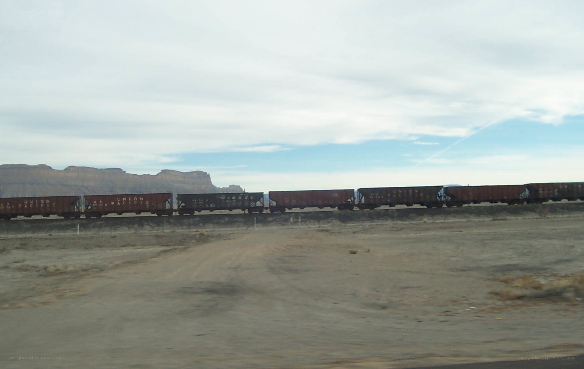 freight train in desert landscape