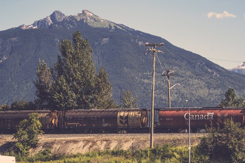 Freight Train in Mountains — Green, Serene, Afternoon