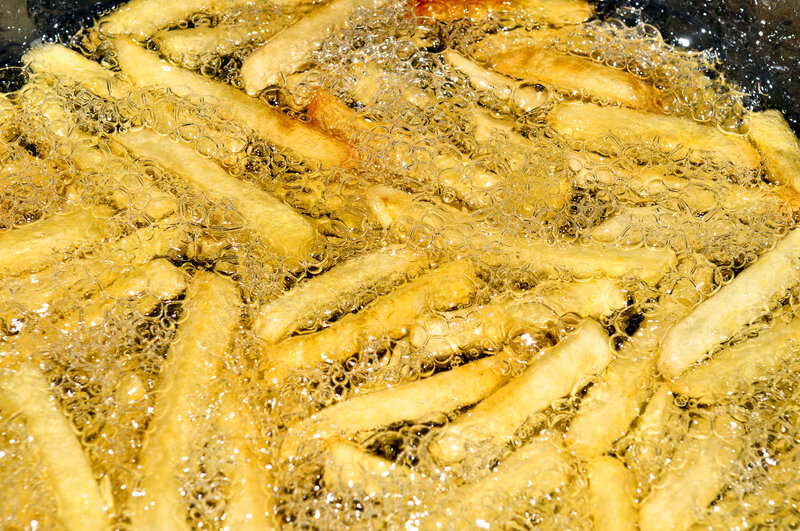 french fries frying in oil