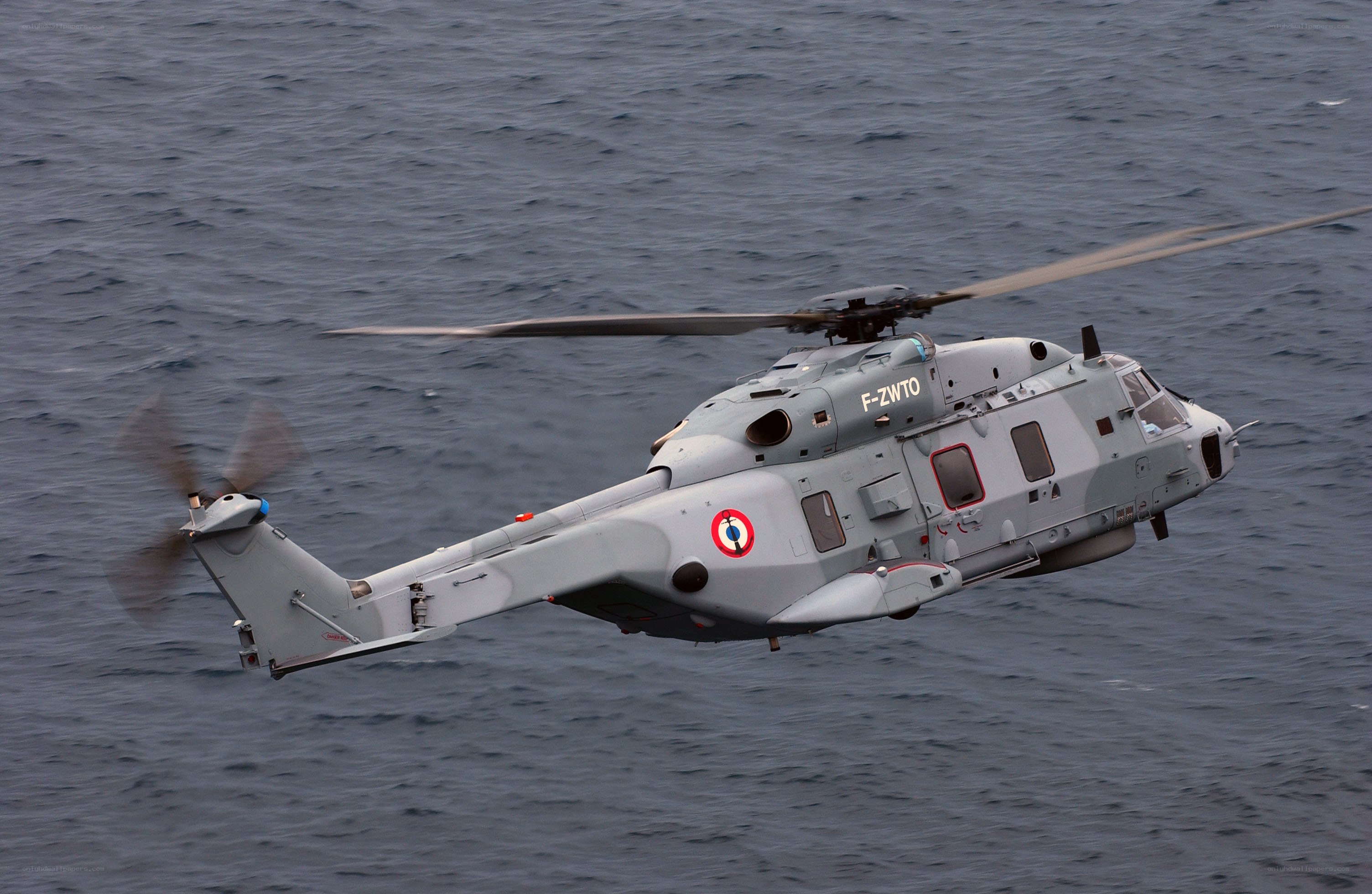 French military helicopter over ocean