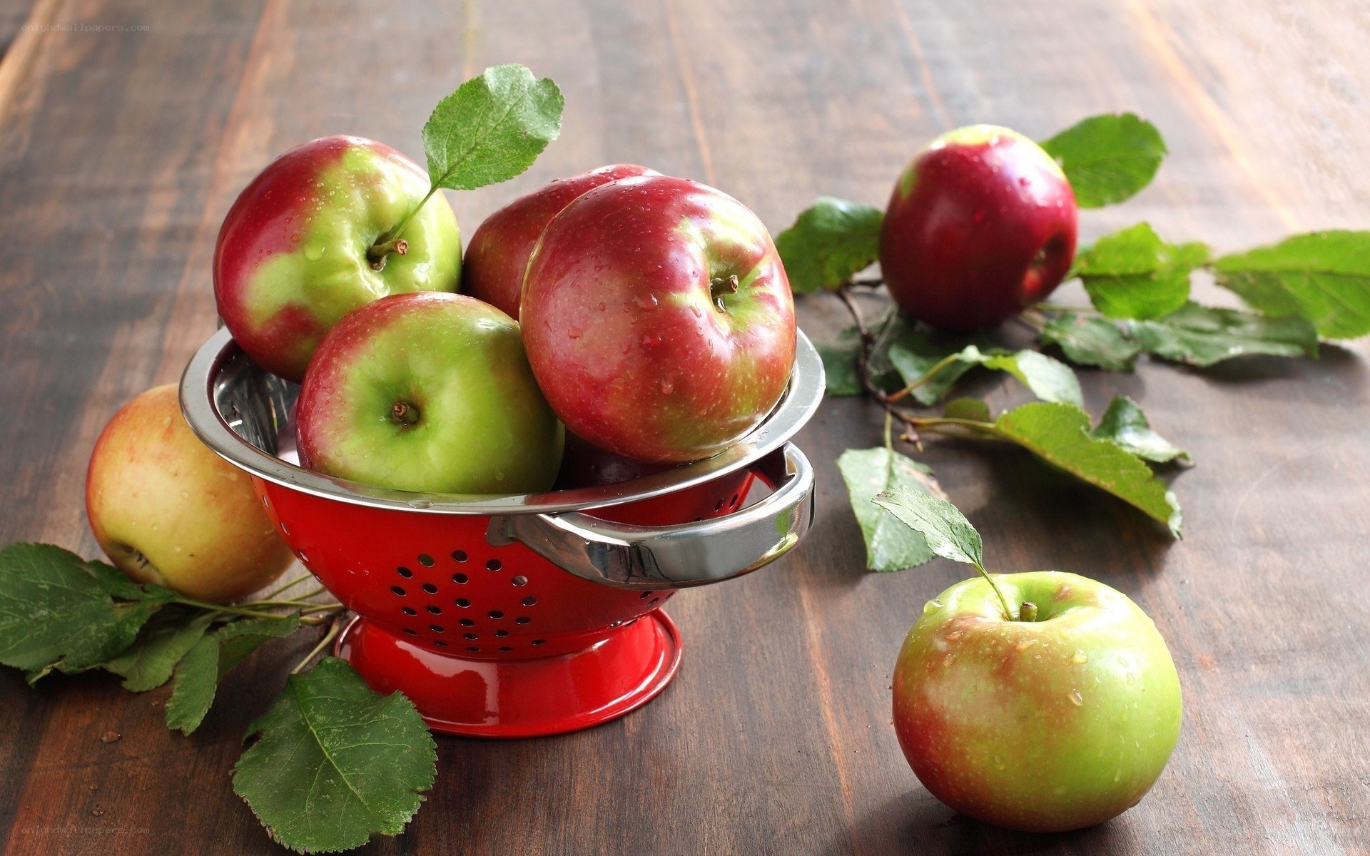 Fresh apples in a colander