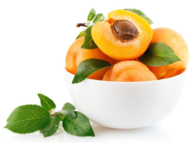 Fresh apricots in a white bowl