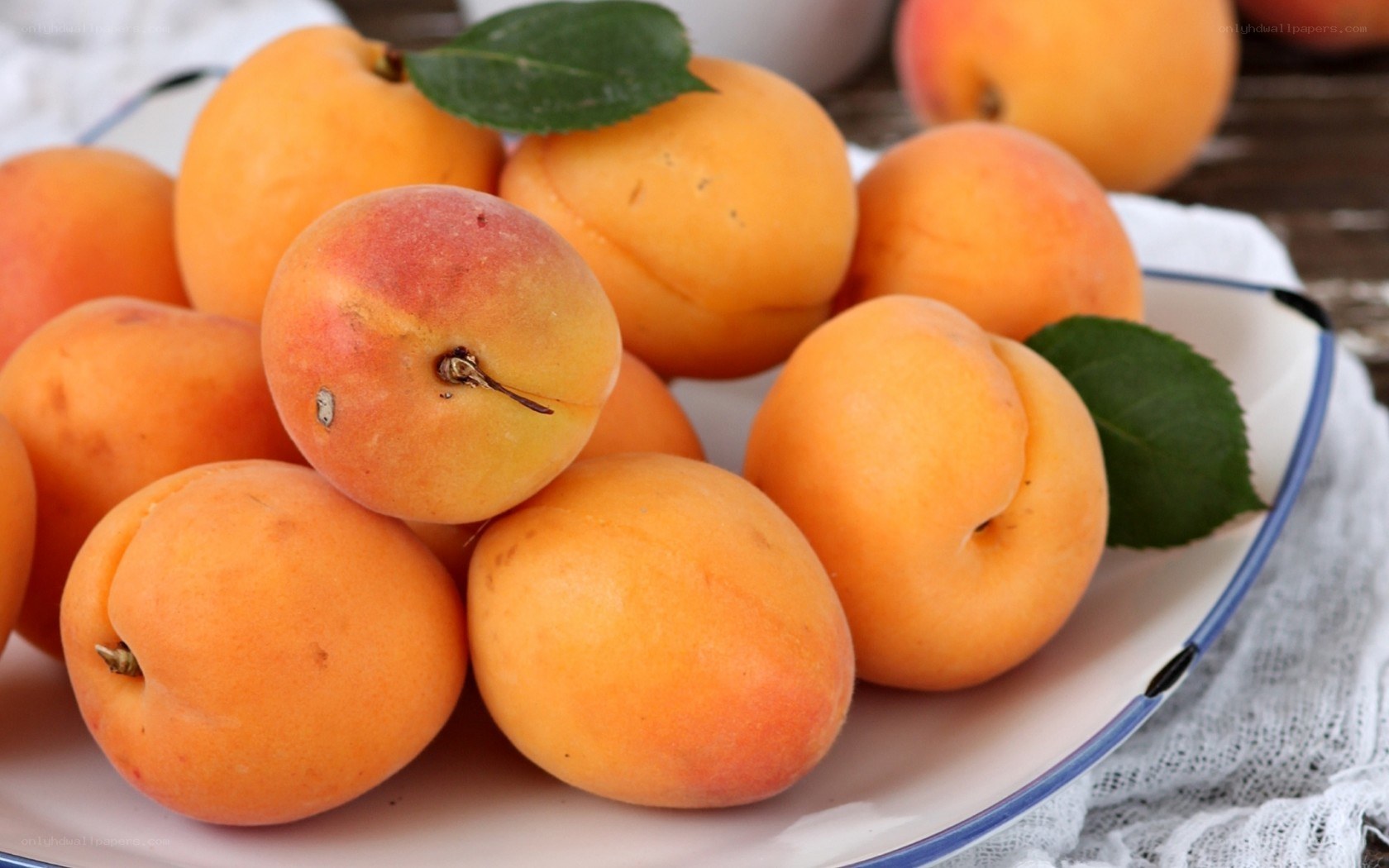 Fresh apricots on a plate