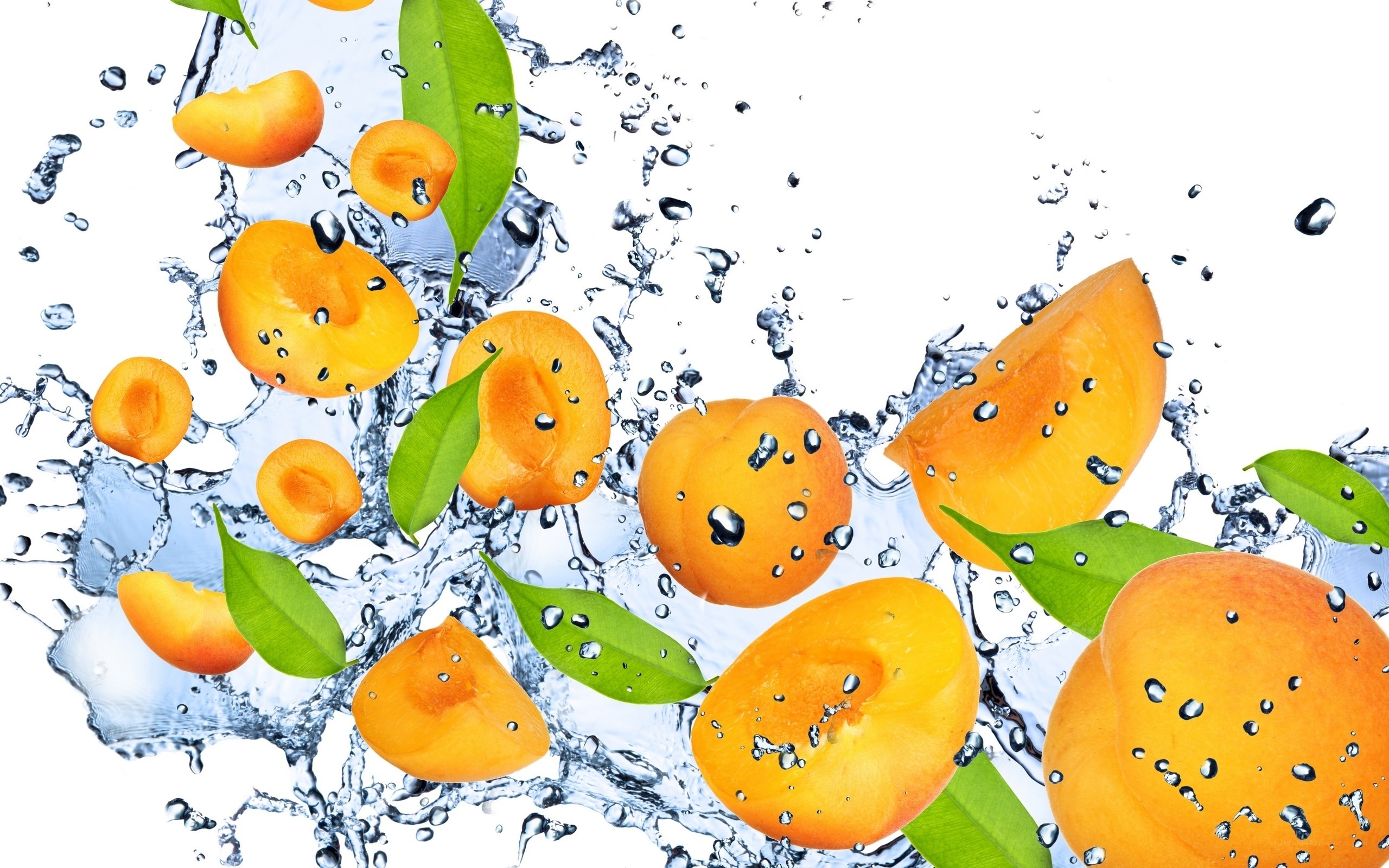 fresh apricots splashing in water