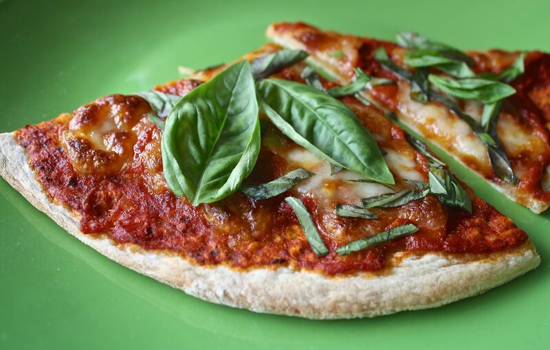 Fresh basil pizza slice