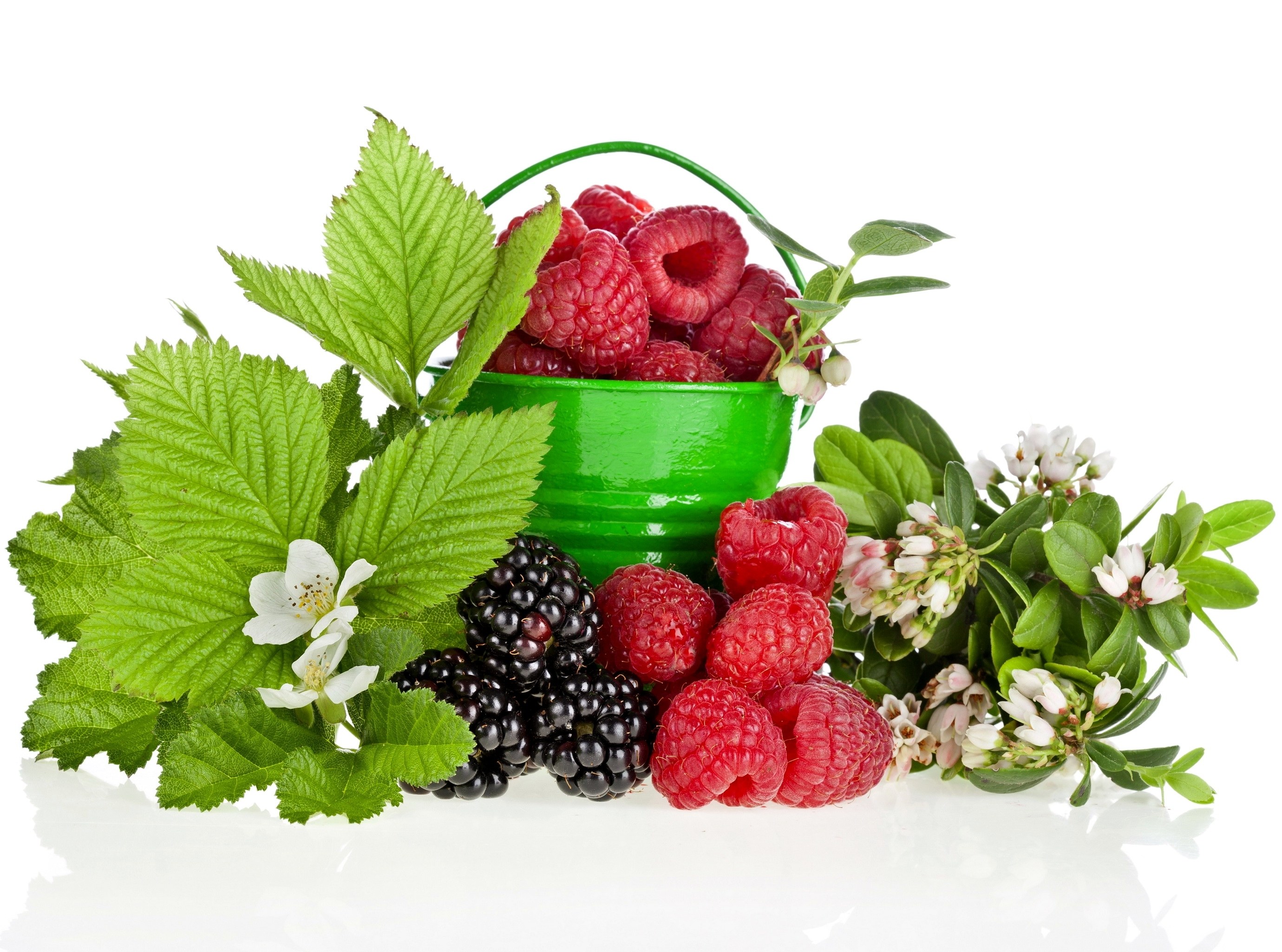 Fresh berries in a green bucket