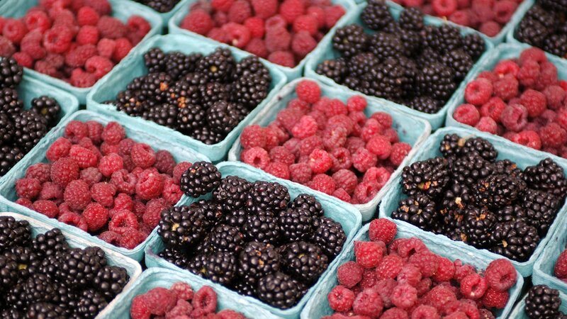 Fresh berries in containers