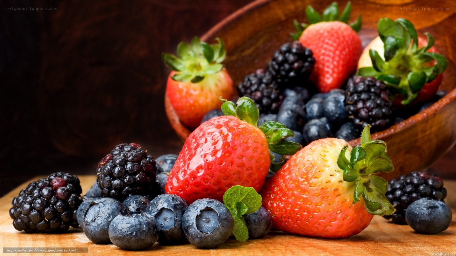 Fresh berries on wooden surface