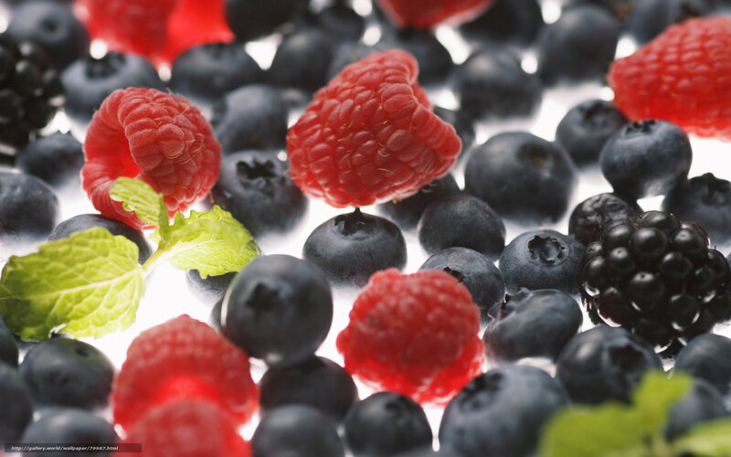 Fresh berries with mint leaves