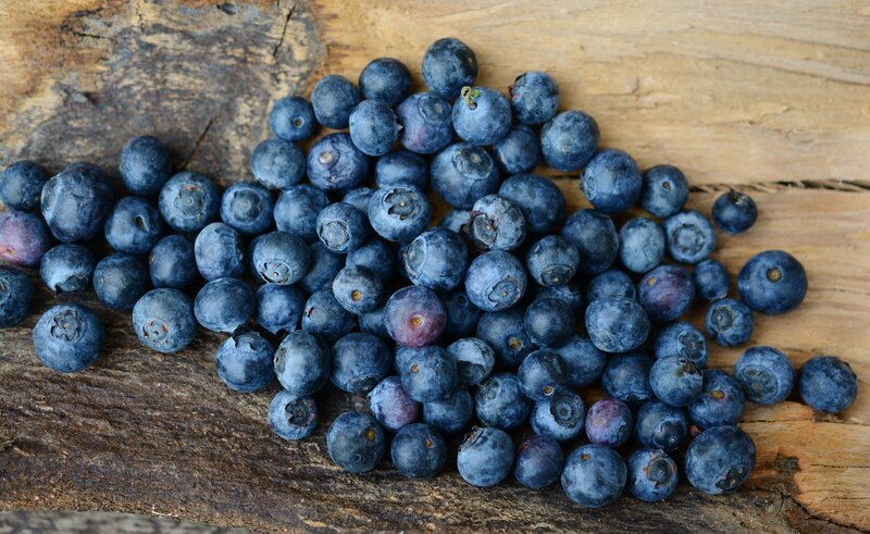 Fresh blueberries on wood