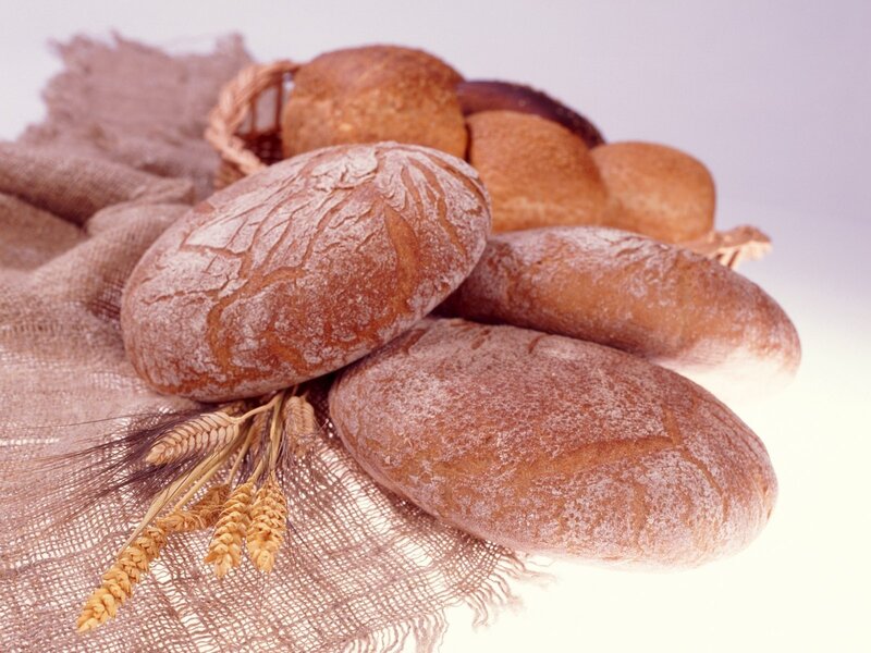 Fresh bread loaves on burlap