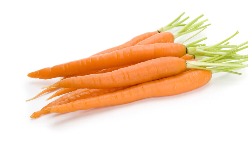 Fresh carrots with green tops