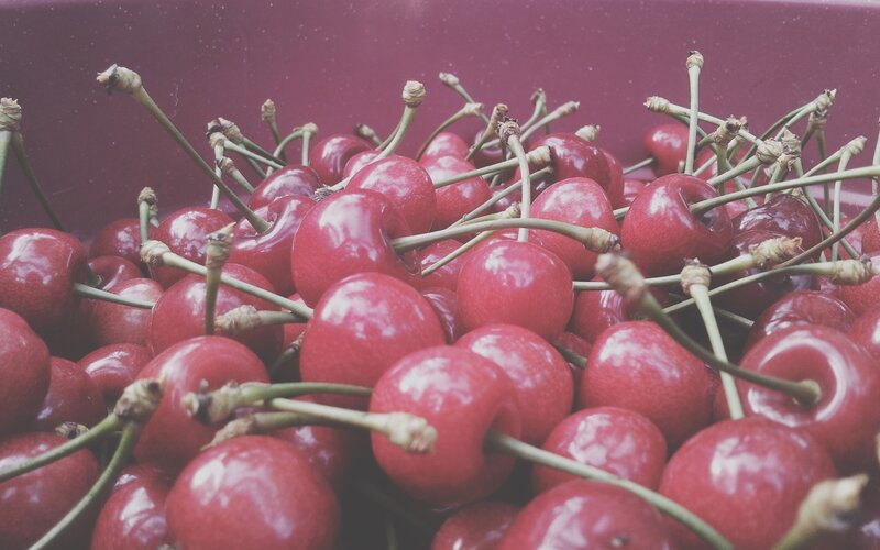 Fresh cherries in a container