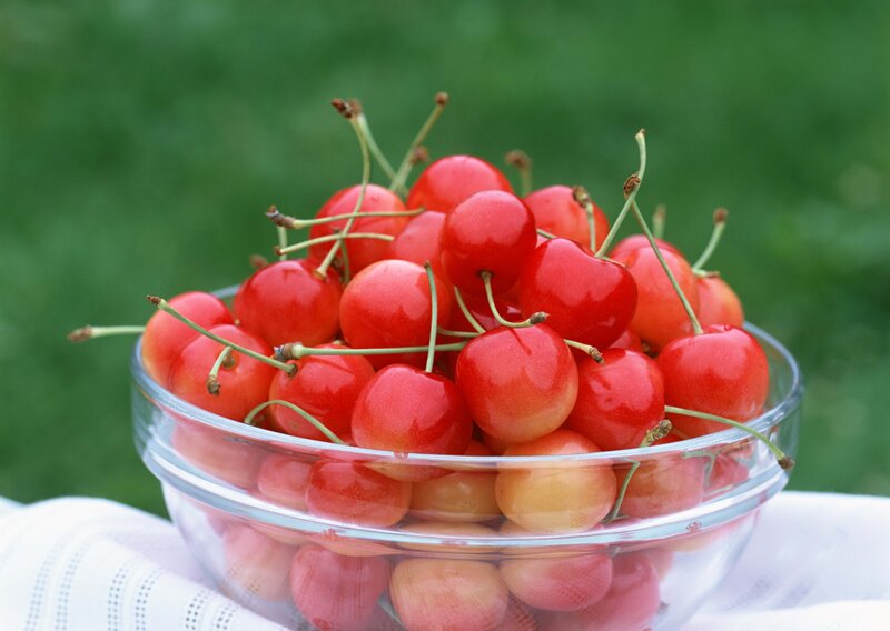 Fresh cherries in a glass bowl