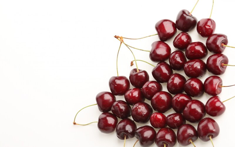 Fresh cherries on white background