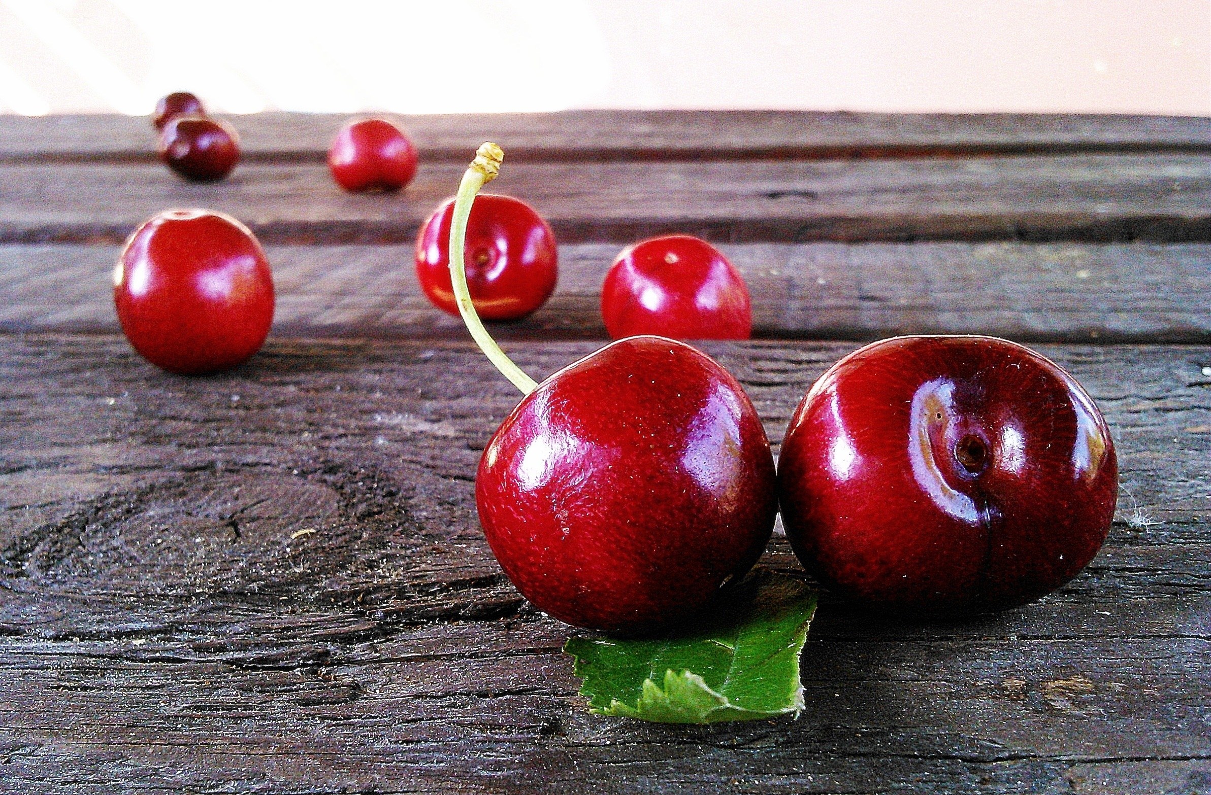 Fresh cherries on wood