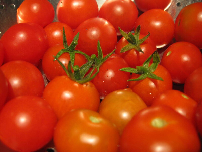 Fresh cherry tomatoes in colander