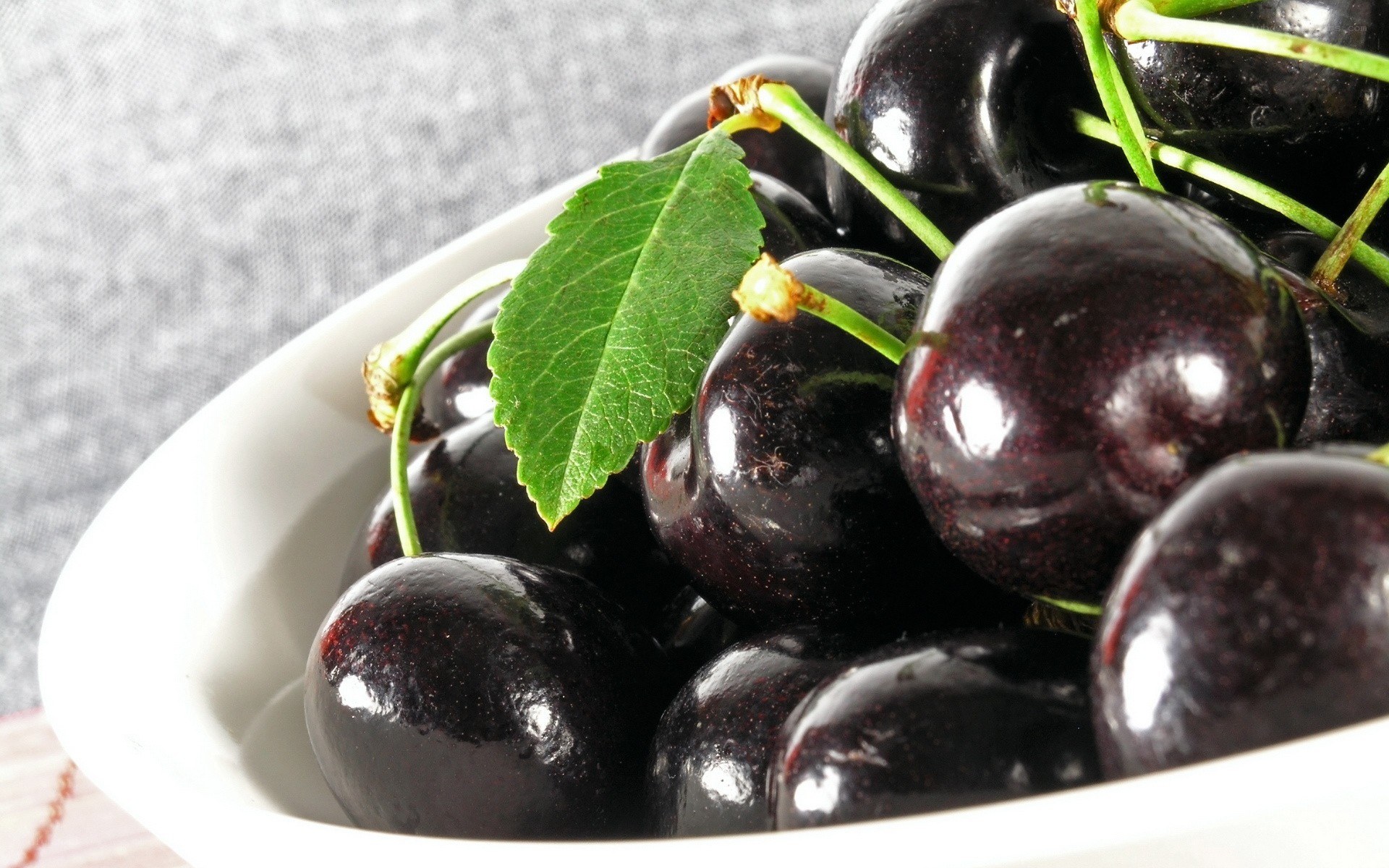 Fresh dark cherries in a bowl