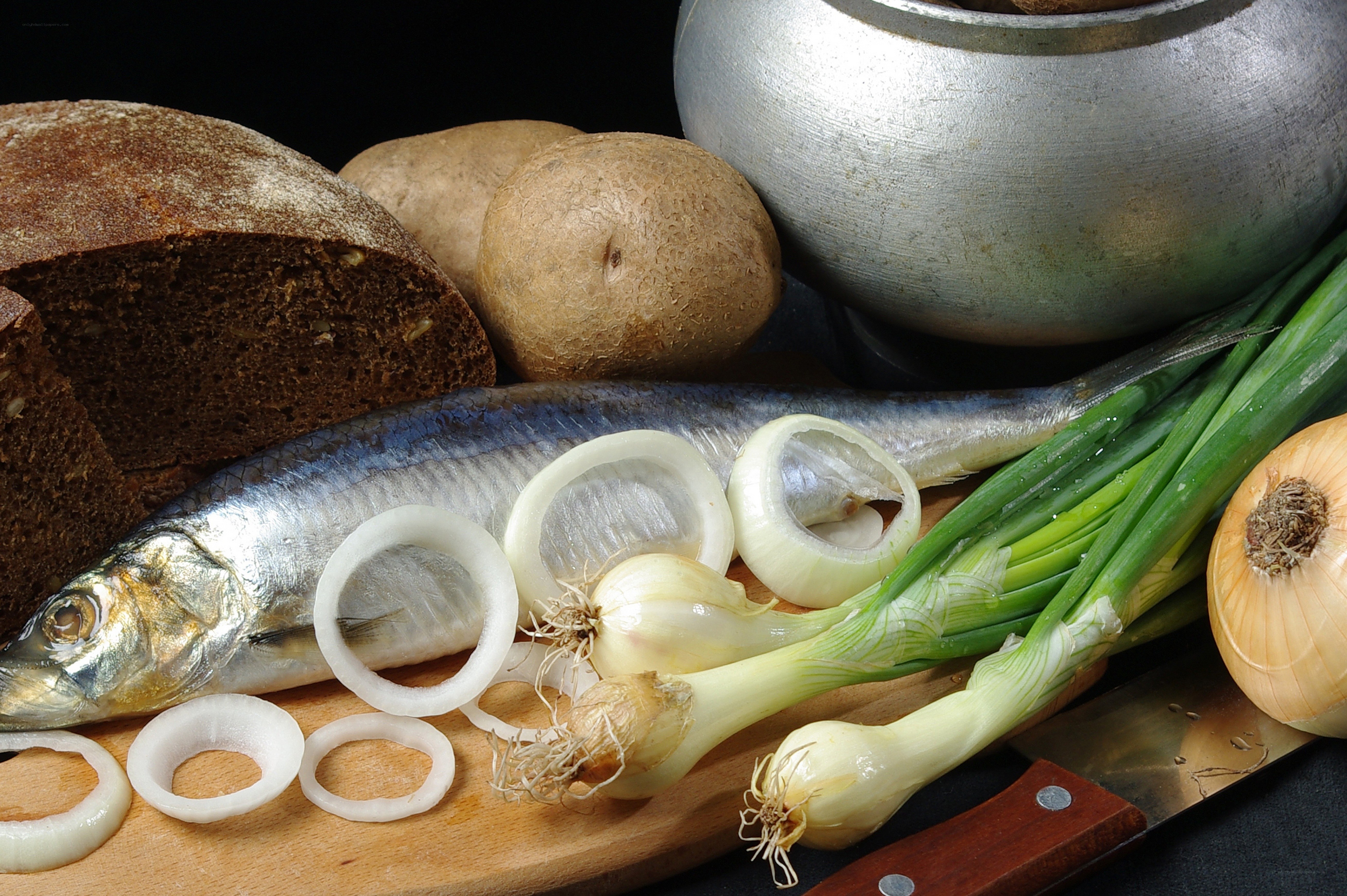 Fresh fish and vegetables on a cutting board