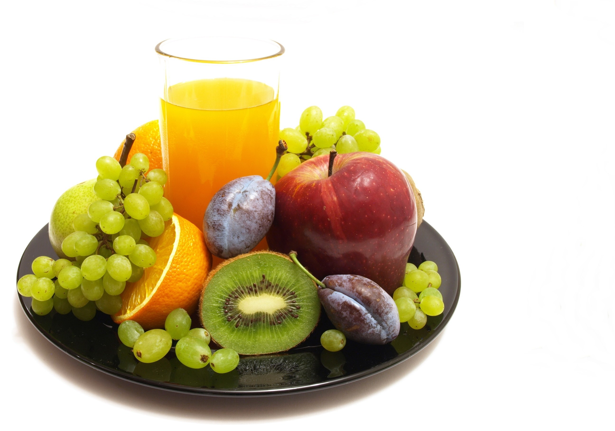 Fresh fruit and juice on a plate