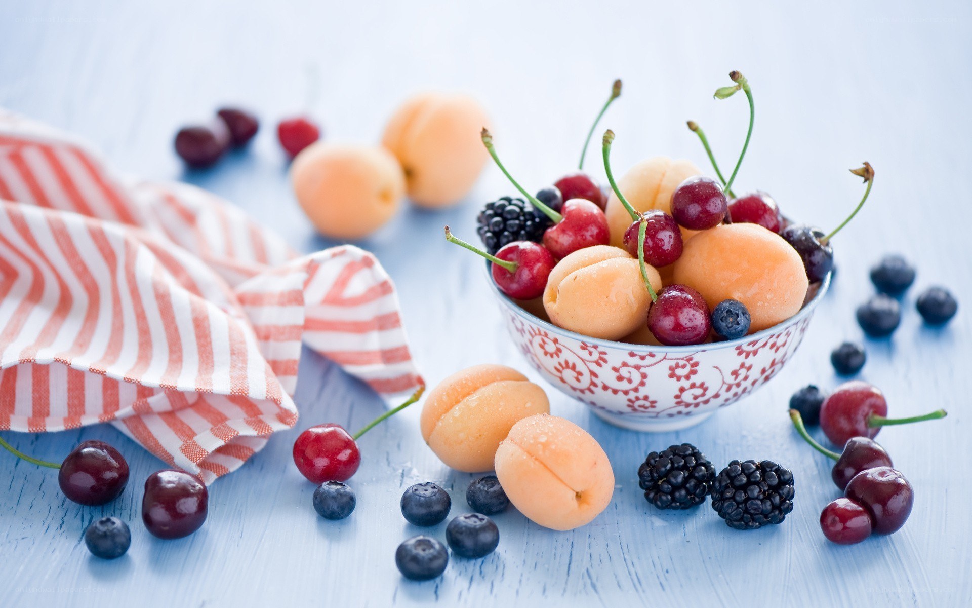 Fresh fruit bowl on blue table