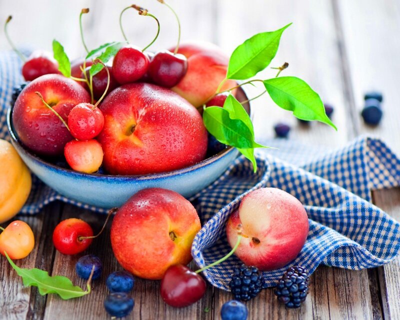 Fresh fruit bowl on wood