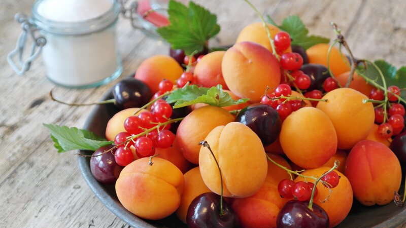 Fresh fruit bowl on wooden table