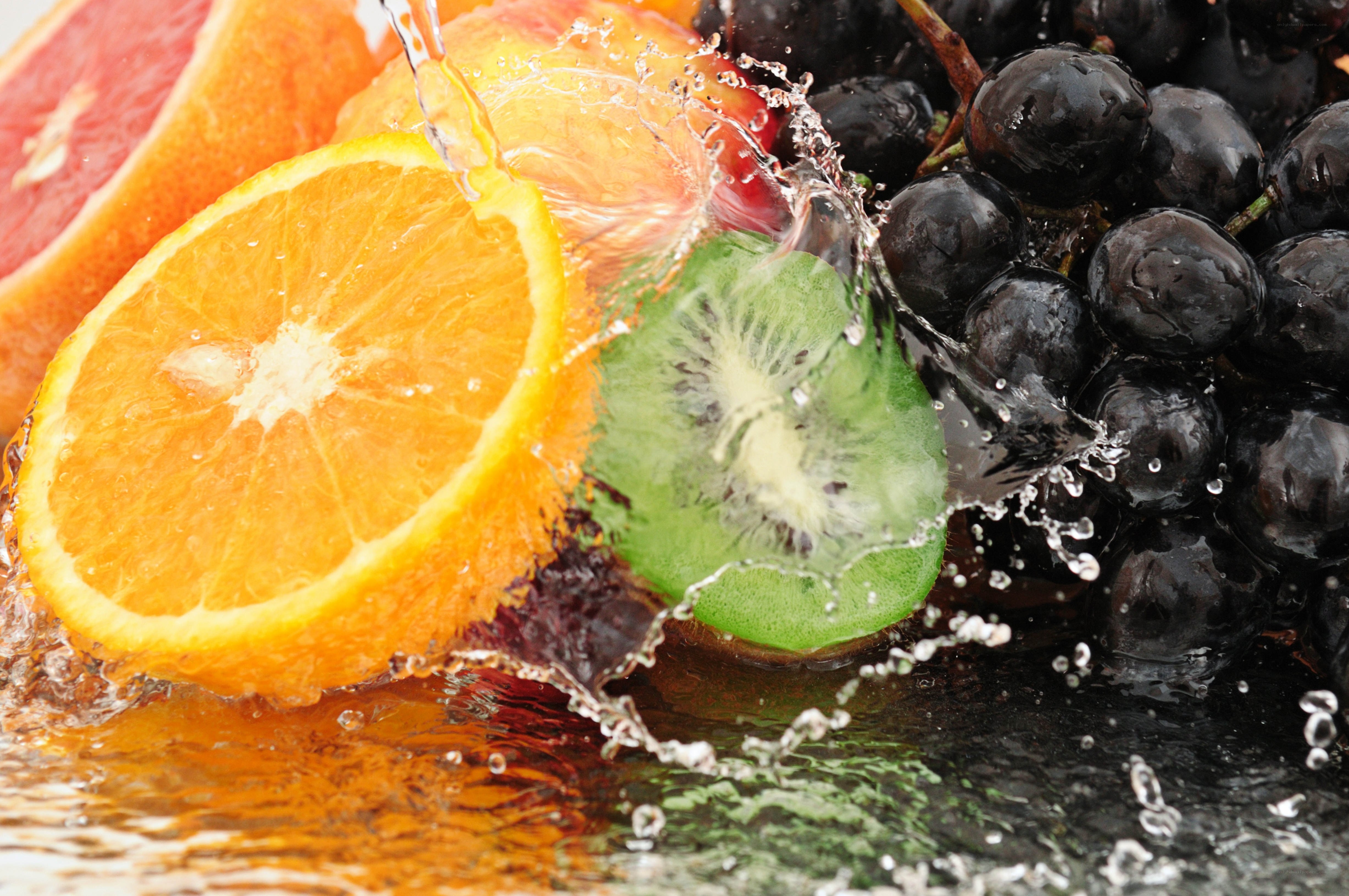 Fresh fruit splashing in water