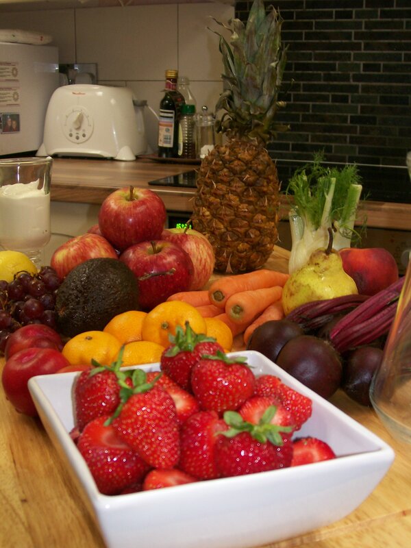 Fresh fruits and vegetables on a kitchen counter