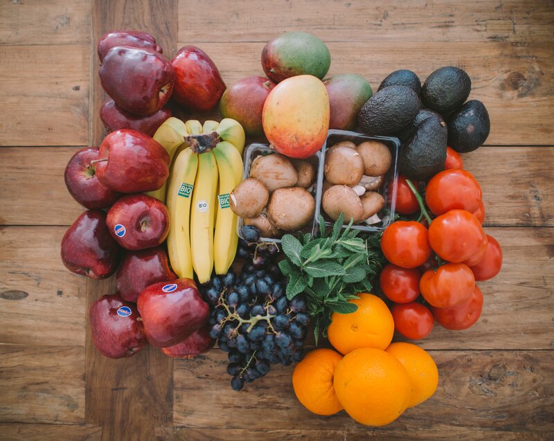 Fresh fruits and vegetables on wood