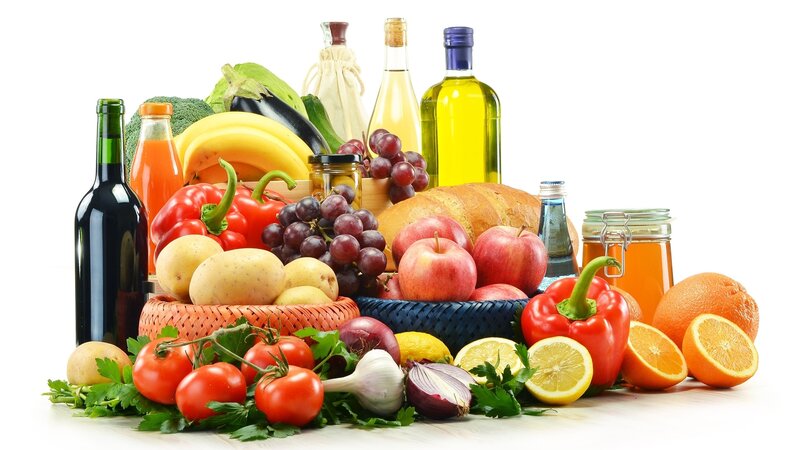 Fresh fruits and vegetables with oils and bread